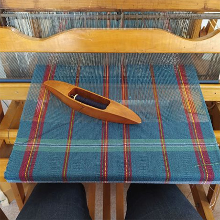 Woven cloth on a loom